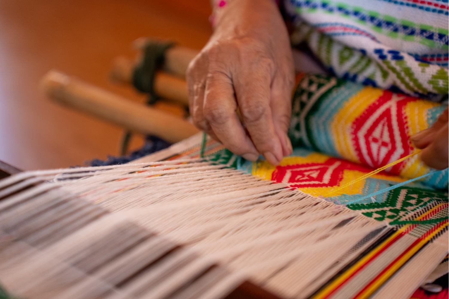 Each piece of fabric features unique patterns, brought to life through the creativity and craftsmanship of Ma artisans.